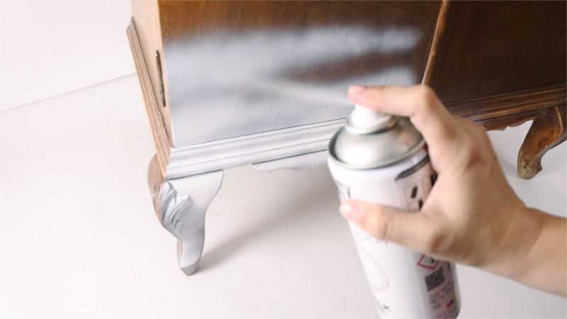 Spraying wooden furniture with chalk paint